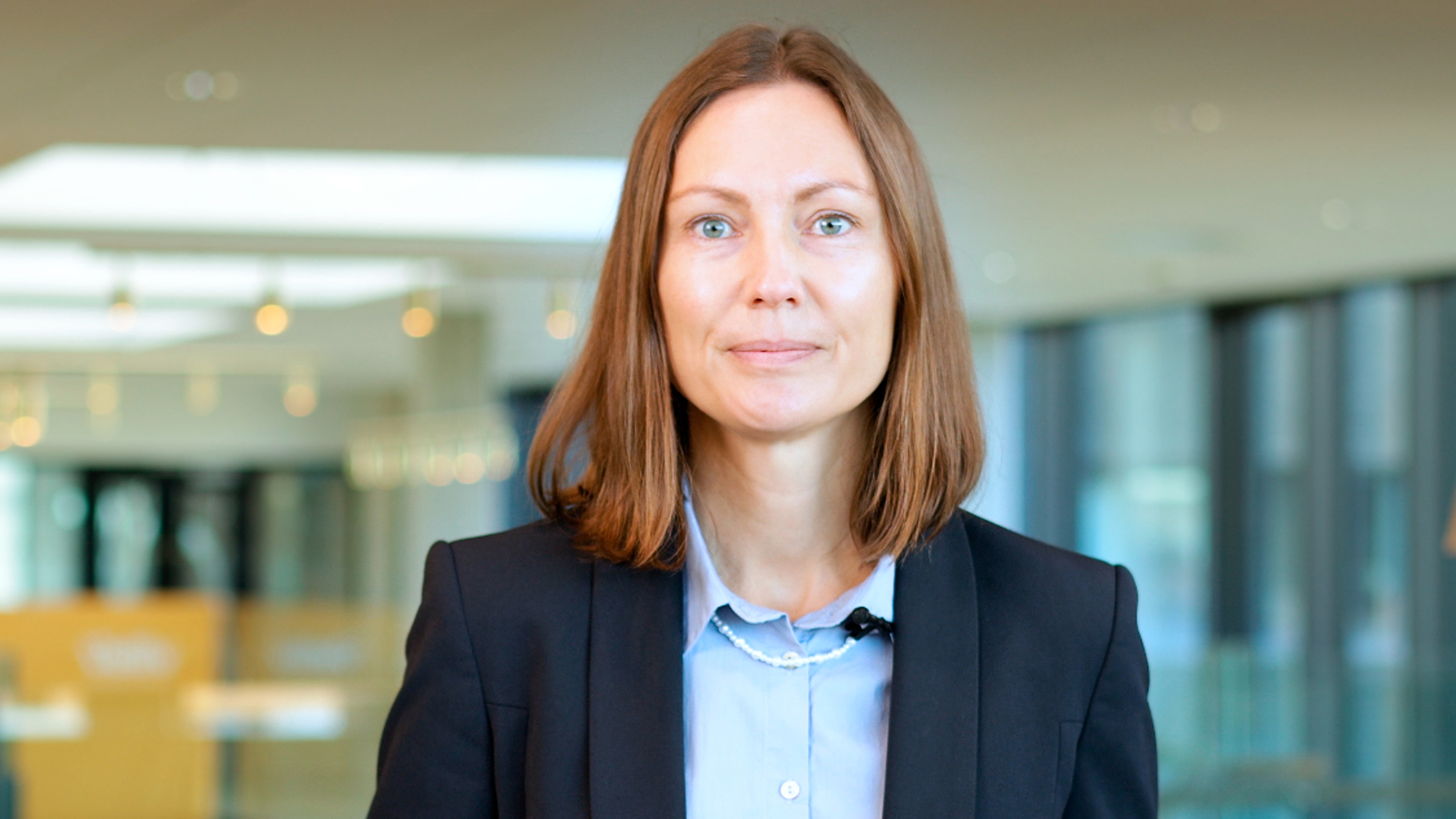 Portræt af Lea Vaisalo, CIO, som præsentere afkast